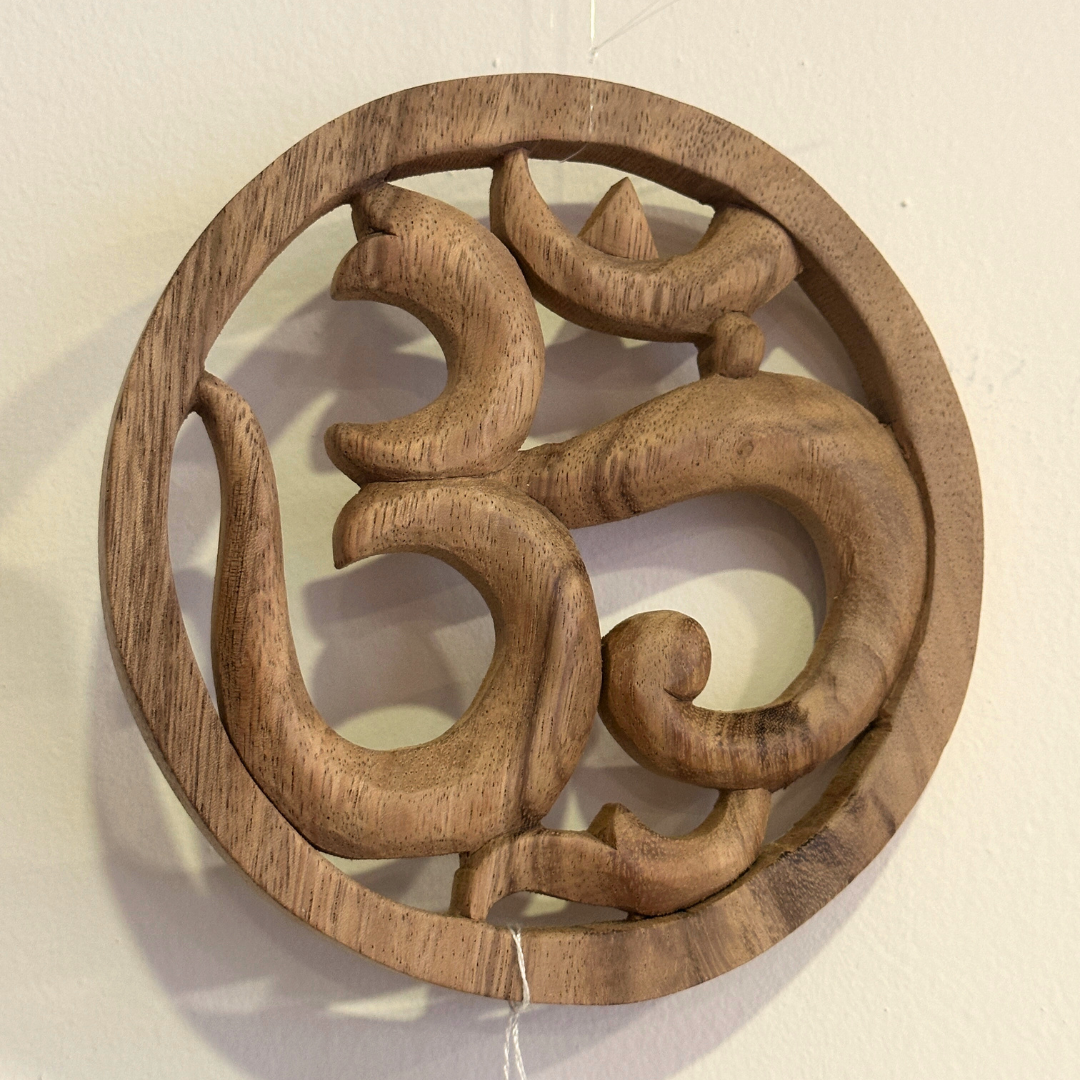 Wood carving Ohm sign